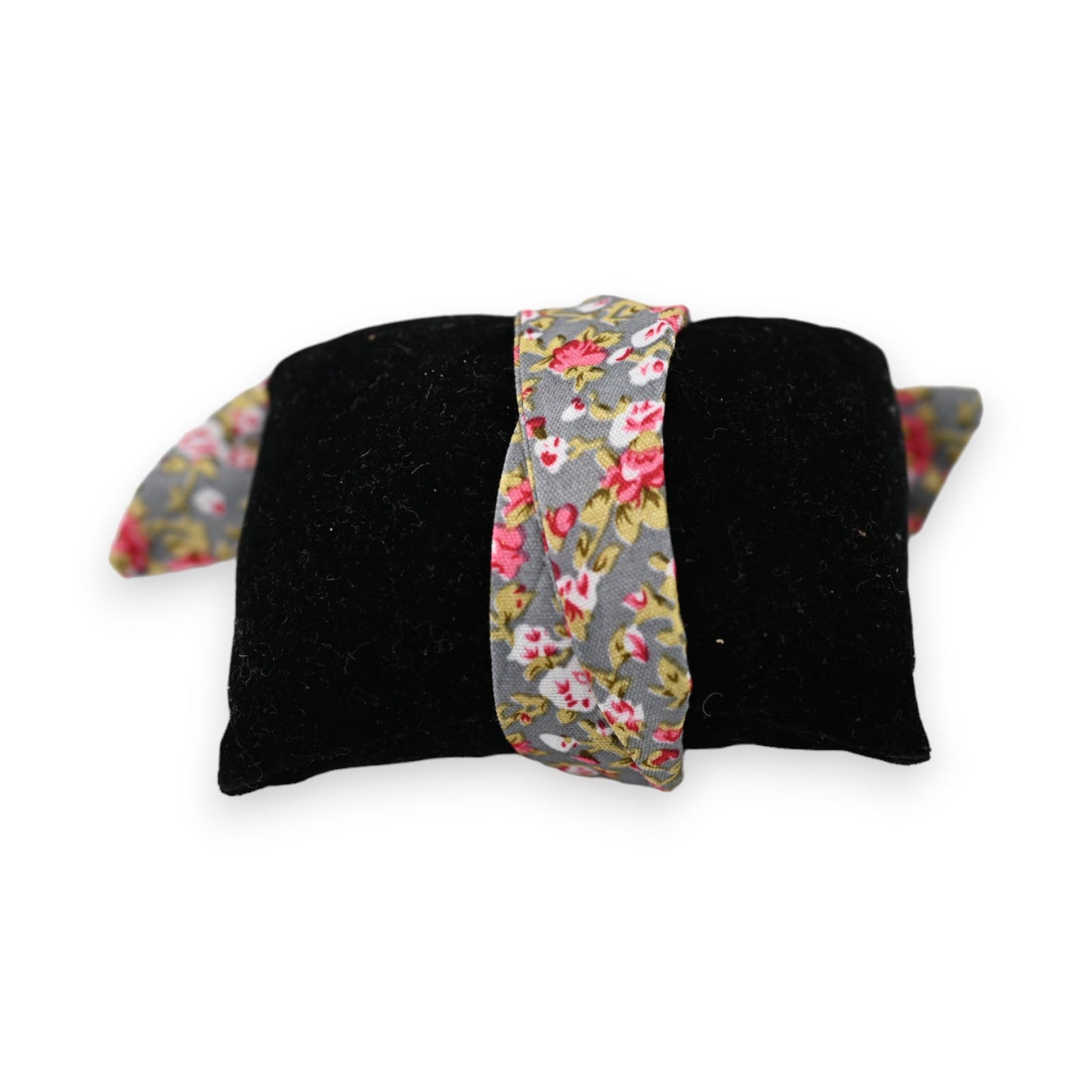 Schwarzes Schmuckkissen mit floralem Armband in Grau, Rosa und Gelb für Armbanduhren, elegantes Accessoire