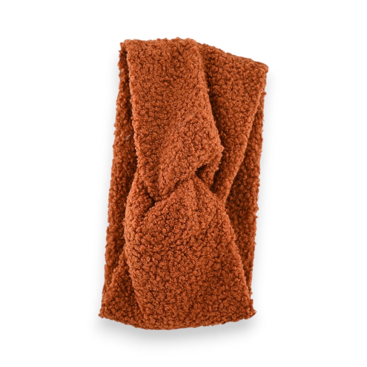 Gedrehtes, lockiges Winter-Stirnband in Ziegelrot. Warmes, flauschiges Accessoire aus weichem Bouclé-Stoff für kalte Tage.