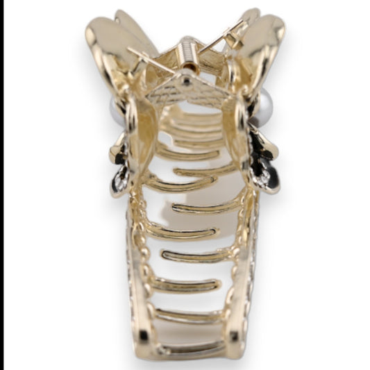 Elegante goldene Haarspange in Form einer Rose mit schwarzen Akzenten und Strass-Steinen, filigrane Metallarbeit