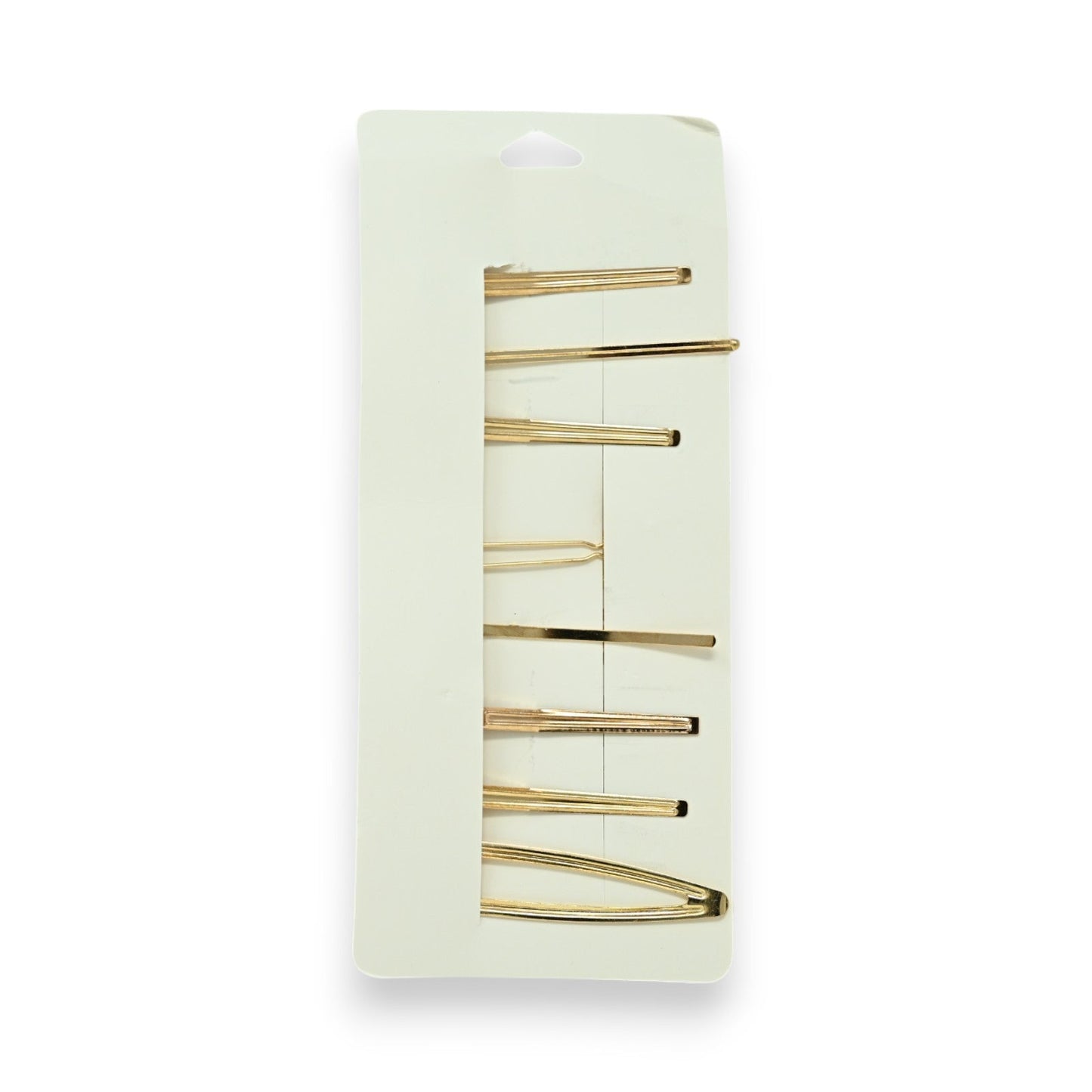Set von 8 goldenen Haarspangen in verschiedenen Formen auf hellgrünem Karton, minimalistisches Design für Haarstyling