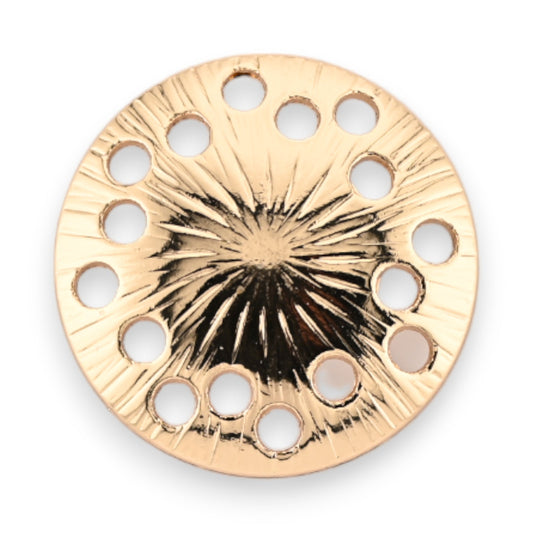 Goldene runde Magnetbrosche mit strahlenförmigem Muster und Löchern am Rand für verschiedene Steine