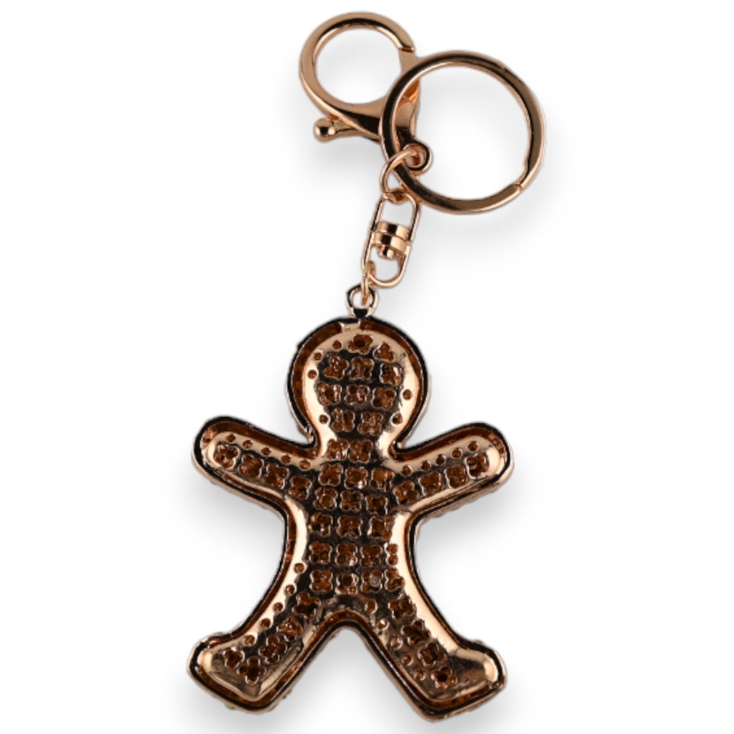 Goldener Schlüsselanhänger in Form eines Keksmanns mit dekorativem Muster, an einem Ring befestigt
