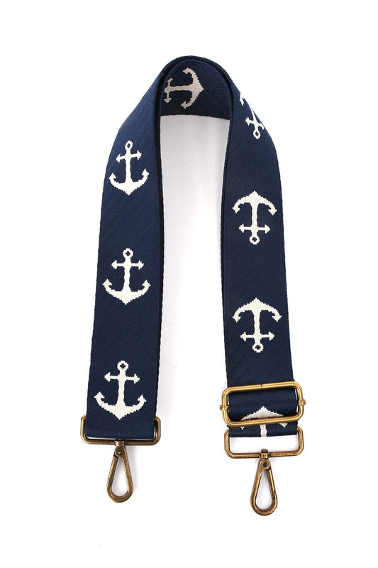 Marineblauer Schulterriemen mit weißen Anker-Motiven, goldenen Metallbeschlägen und Karabinerhaken