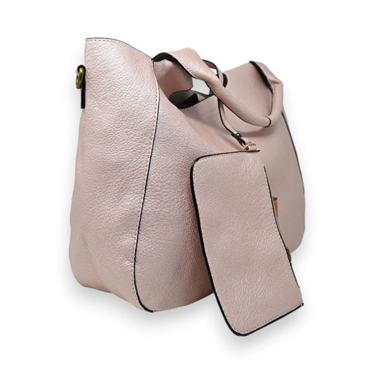 Elegante metallic rosa Lederhandtasche mit abnehmbarer Clutch, seitlicher Ansicht und strukturierter Oberfläche