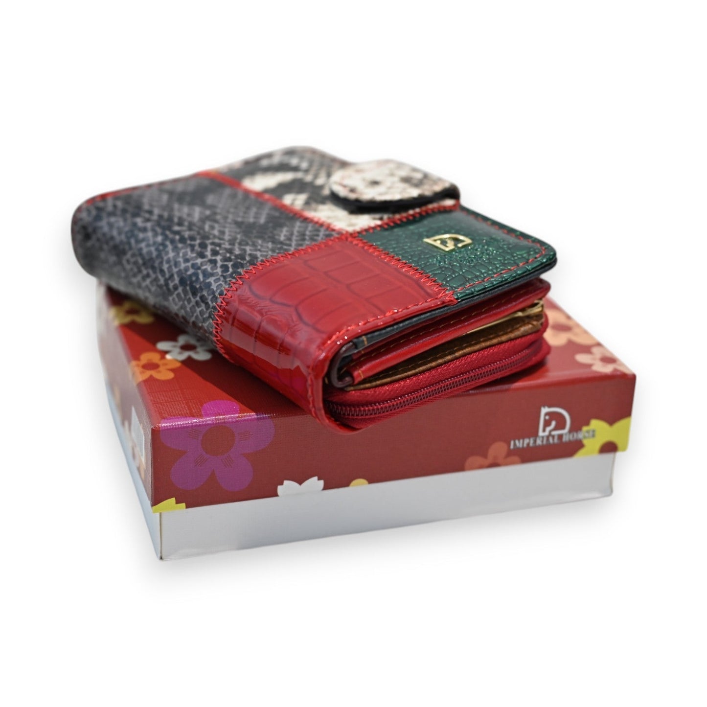 Patchwork-Geldbörse aus Python-Leder in Rot, Grün und Grau auf bunter Geschenkbox der Dark Horse Kollektion