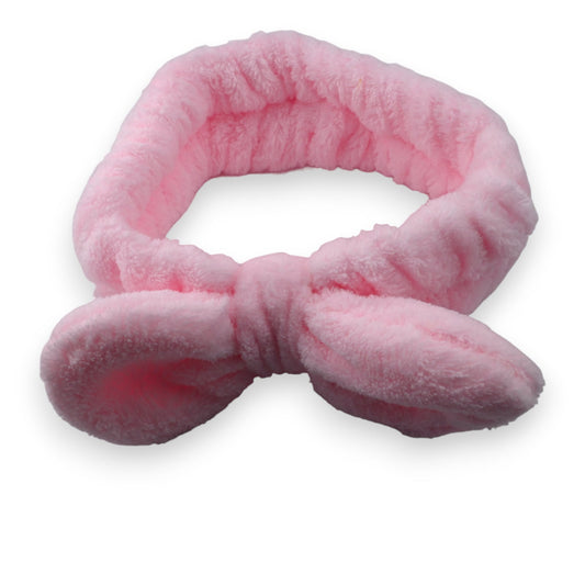 Flauschiges rosa Stirnband mit Schleife für Make-up und Kosmetik, aus weichem Plüsch gefertigt