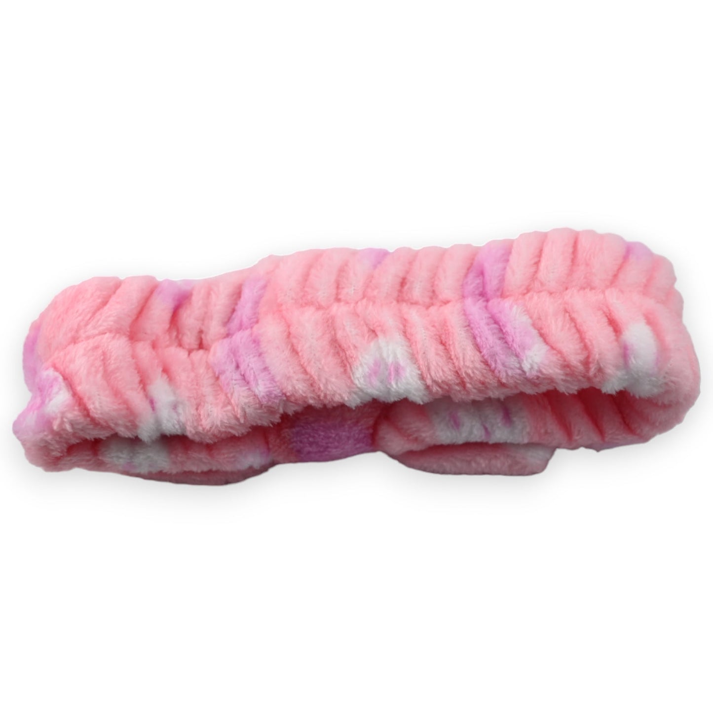 Flauschiges rosa Stirnband mit weißen und lila Akzenten, geeignet für Make-up und Haarpflege, auf weißem Hintergrund