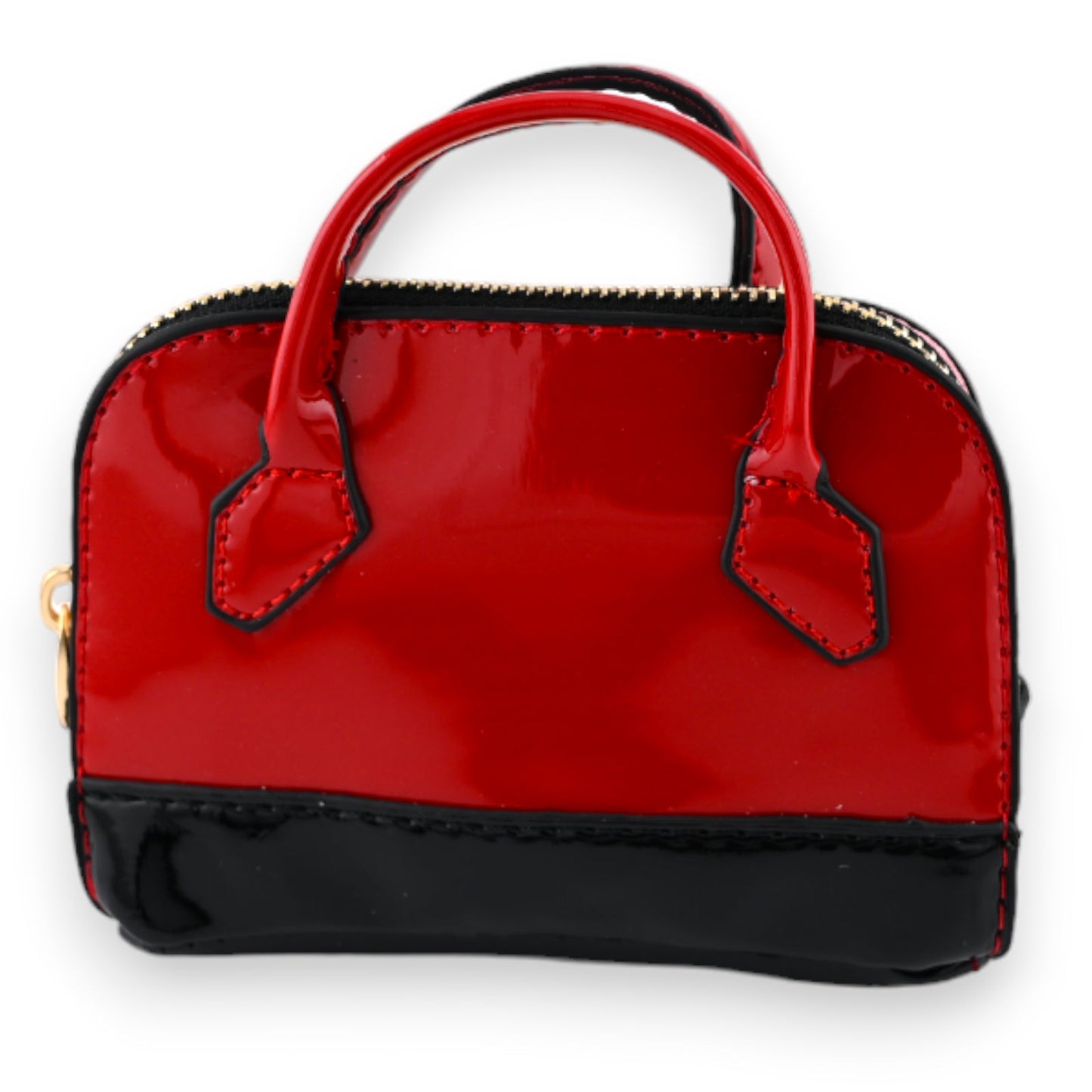 Kleine rote Lackhandtasche mit schwarzen Details, Reißverschluss und Henkeln als Schlüsselanhänger und Geldbörse