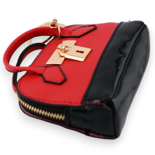 Rote Mini-Handtasche als Schlüsselanhänger mit goldenem Schloss, schwarzen Akzenten und Reißverschluss, Luxus-Accessoire