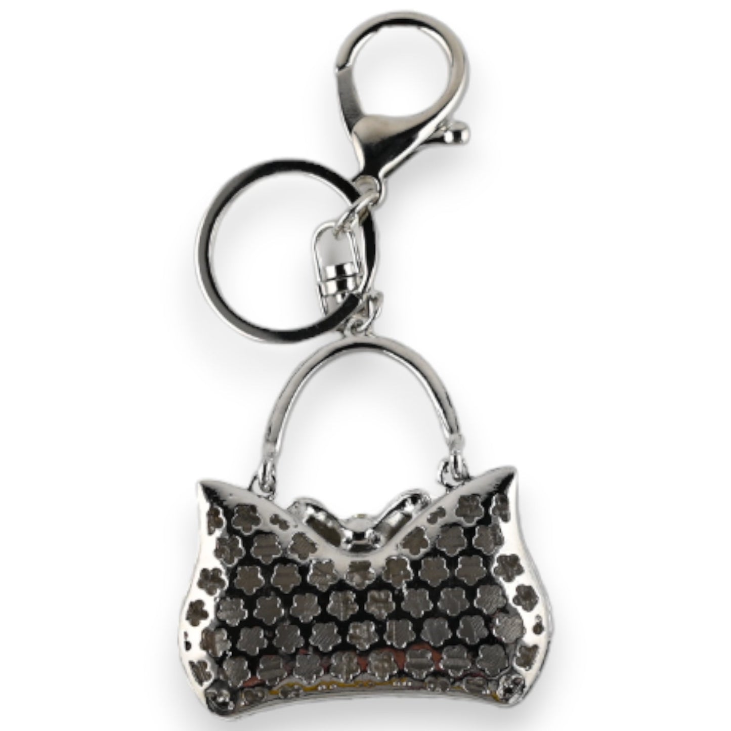 Silberner Schlüsselanhänger mit Anhänger in Form einer Handtasche, verziert mit schwarz-weißem Blumenmuster