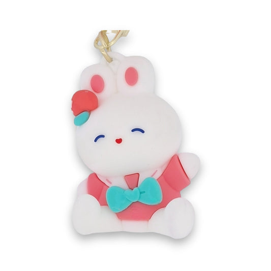 Niedlicher weißer Kaninchen-Schlüsselanhänger mit rosa Ohren, türkiser Schleife und fröhlichem Gesicht als Accessoire