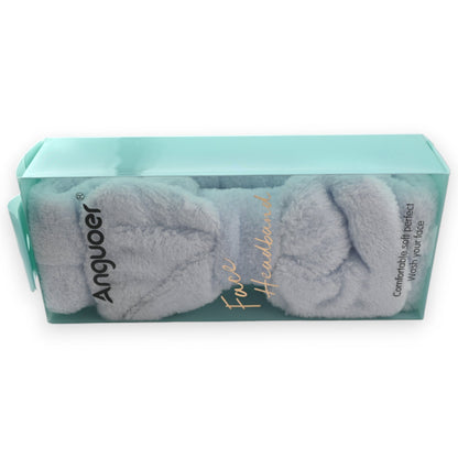 Flauschiges graues Stirnband von Anguoer in türkisfarbener Verpackung, ideal für Gesichtspflege und Make-up