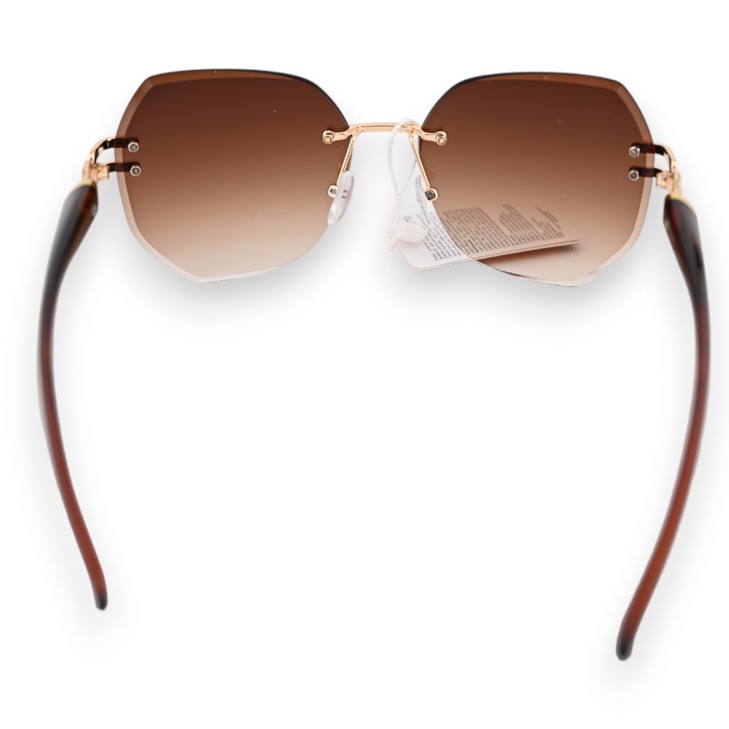 Randlose Sonnenbrille mit braunen Gläsern, goldenem Rahmen und braunen Bügeln. Elegantes Design mit Preisschild.