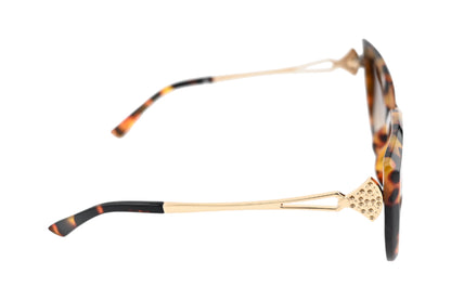 Elegante Sonnenbrille mit Leopardenmuster und goldfarbenen Bügeln, verziert mit glitzerndem Schmuckelement