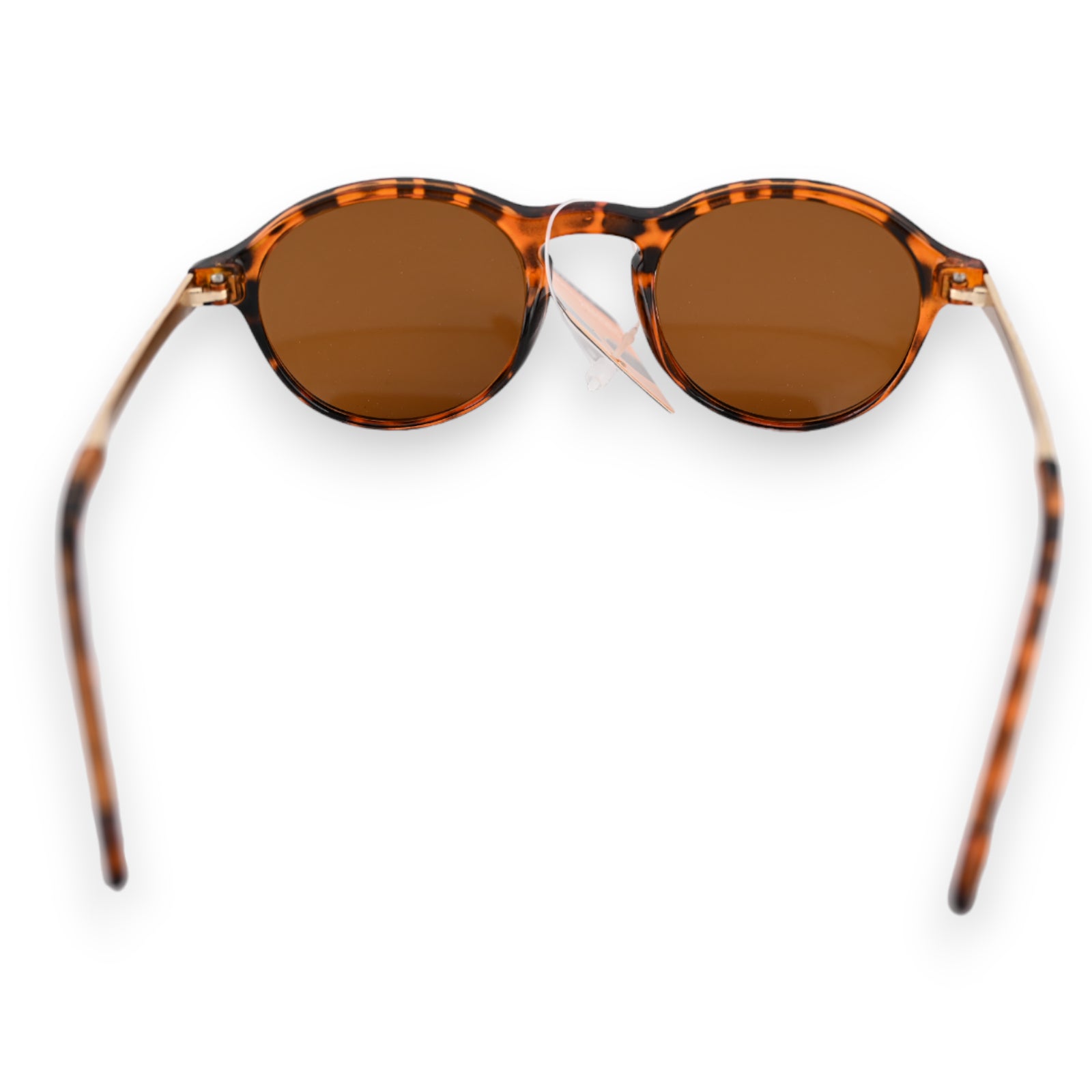 Runde Sonnenbrille mit braunen Gläsern und geflecktem Gestell in Schildpattoptik, von oben fotografiert