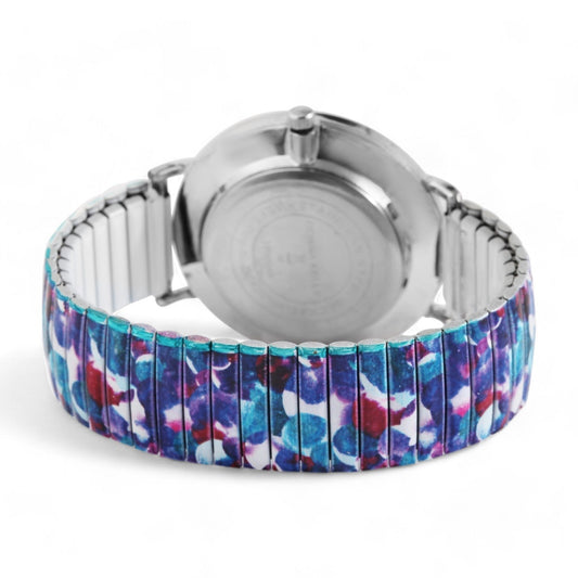 Silberne Armbanduhr mit buntem elastischem Armband in Blau, Lila und Rot, Galaxie-Muster, Rückansicht