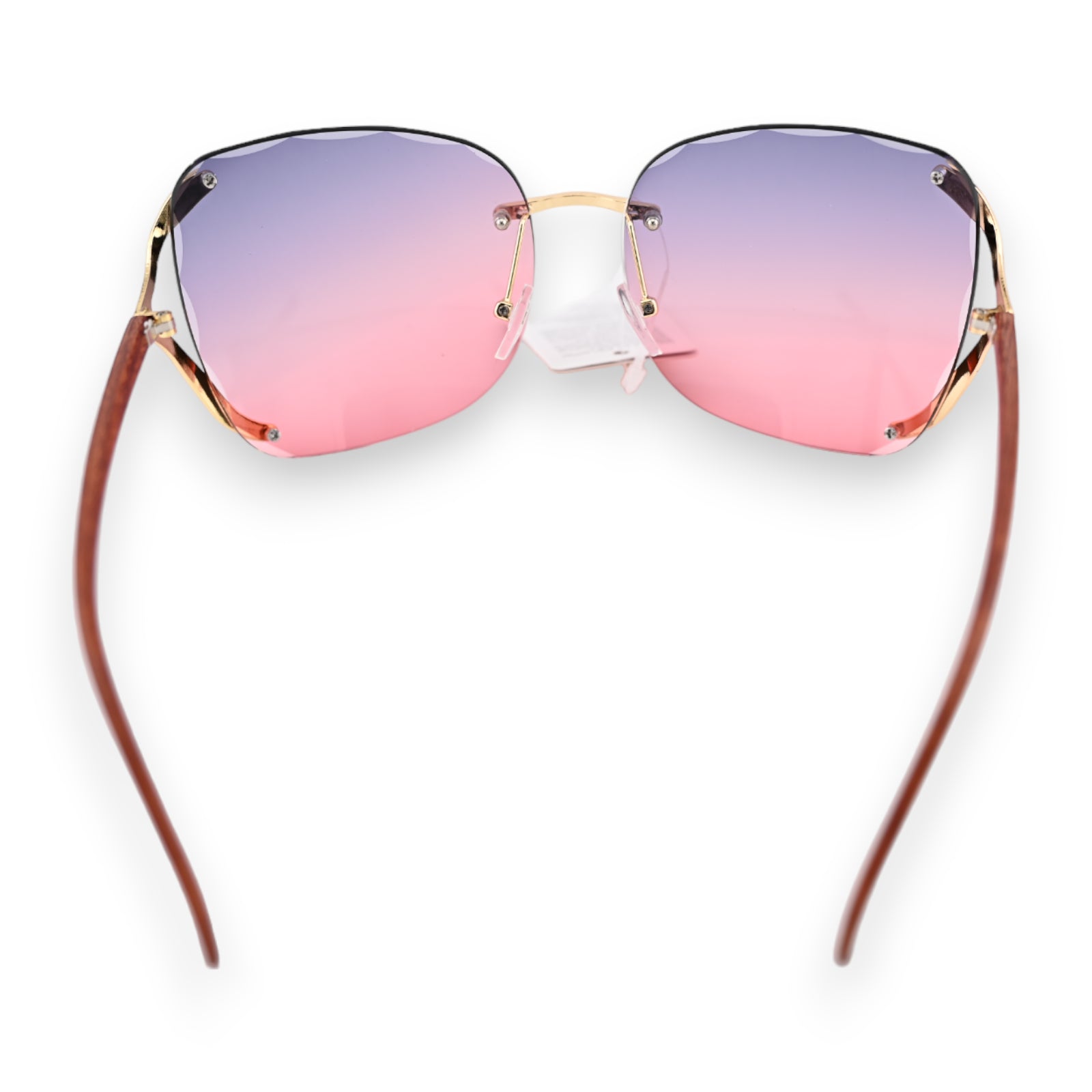 Sonnenbrille mit rahmenlosem Design, Farbverlauf von Lila zu Rosa, goldene Bügel und braune Brillenbeine