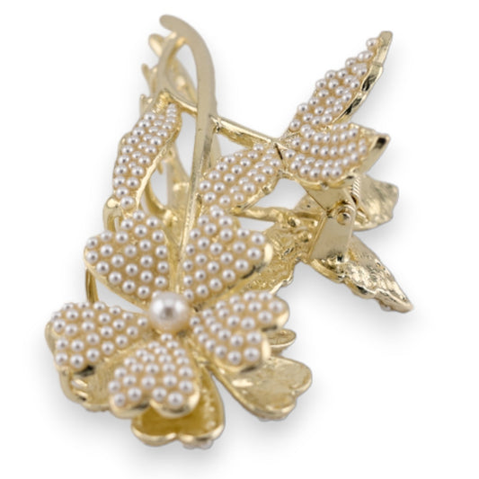Elegante goldene Haarspange mit Blumenmotiv, besetzt mit kleinen Perlen, luxuriöses Haaraccessoire