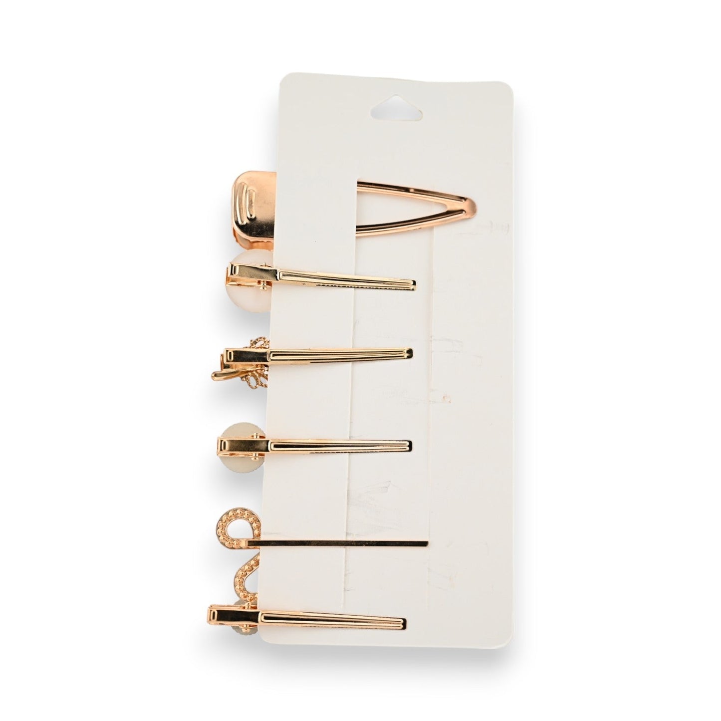 Elegantes Set aus 6 goldenen Haarspangen mit verschiedenen Designs, inklusive Perlen und Strasssteinen, auf weißer Karte