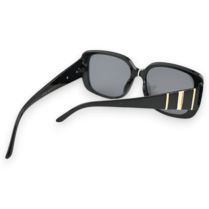 Elegante schwarze Sonnenbrille mit großen Gläsern und goldfarbenen Akzenten an den Bügeln, seitliche Ansicht