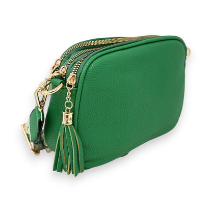 Grüne rechteckige Umhängetasche aus Leder mit Reißverschlüssen, Goldakzenten und Quastenanhänger