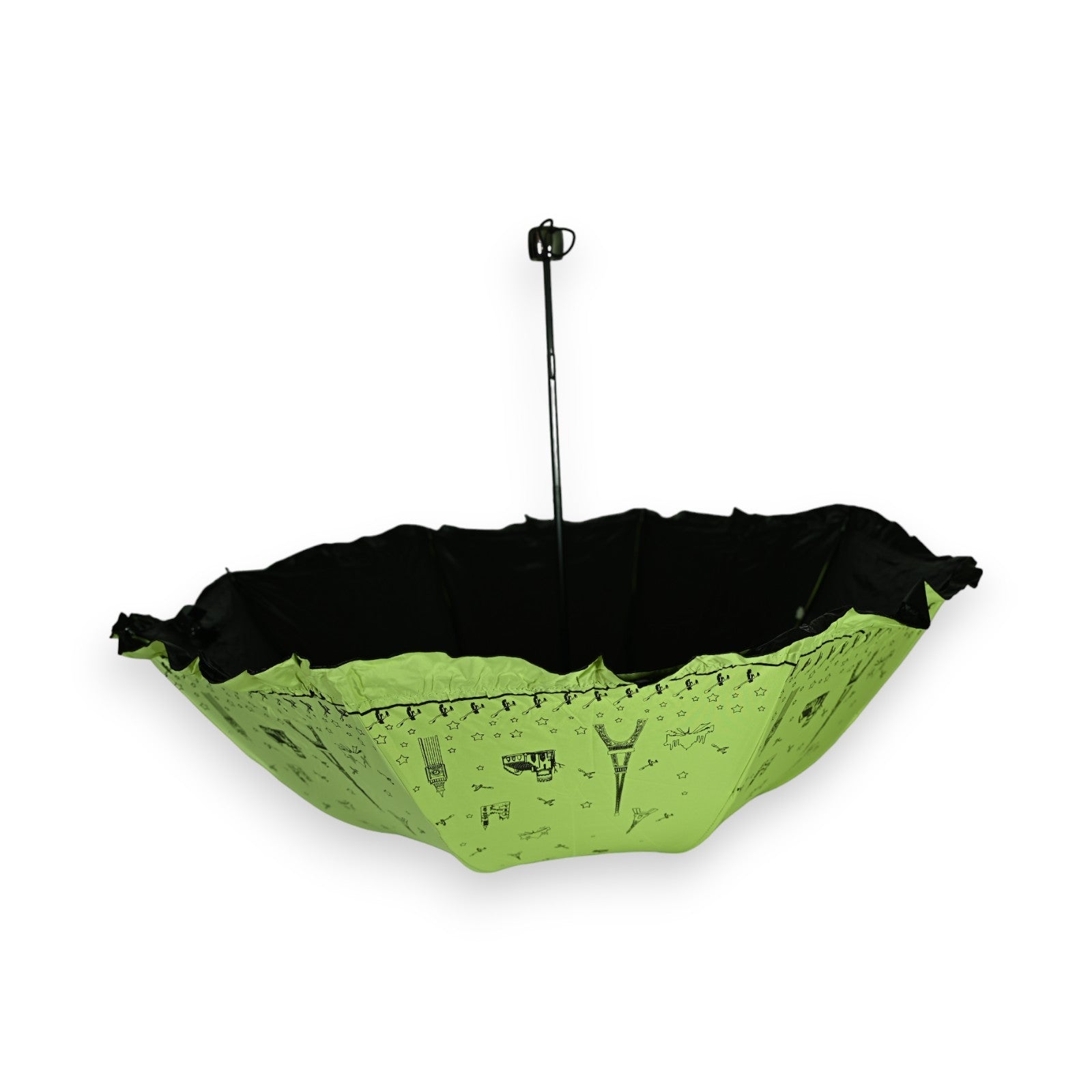 Grüner Faltschirm mit schwarzem Innenfutter, Rüschen und Eiffelturm-Motiv. Romantisches Design für Regentage.