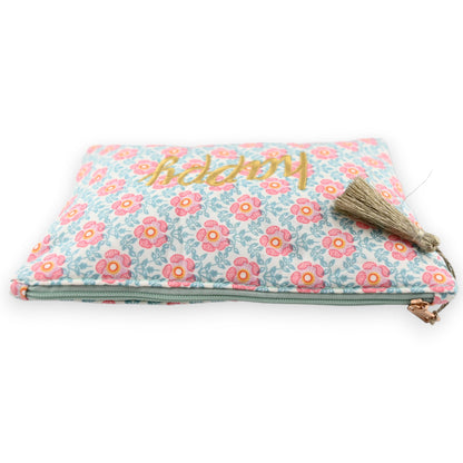 Stofftasche mit Blumenmuster in Rosa und Hellblau, goldener 'happy' Schriftzug, Reißverschluss und Quaste