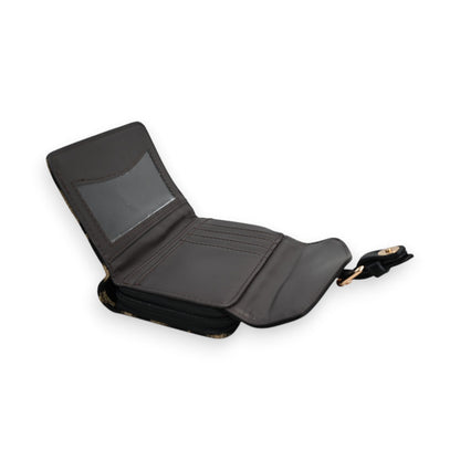 Kompakte zweifarbige Leoparden-Geldbörse in Schwarz, geöffnet, mit Kartenfächern und Reißverschluss, von Melanie Paris