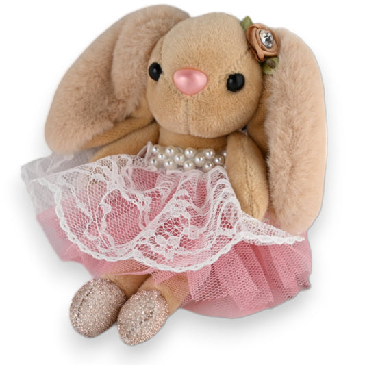 Plüschiger Hase als Schlüsselanhänger mit rosa Tutu-Rock, Perlenkette und glitzernden Füßen, niedliches Accessoire