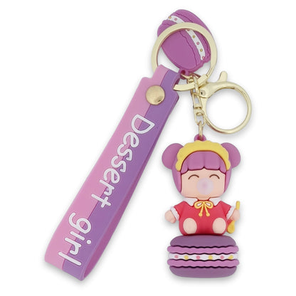 Baby-Schlüsselanhänger mit Kaugummi auf seinem Macaron