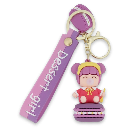 Baby-Schlüsselanhänger mit Kaugummi auf seinem Macaron