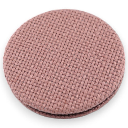 Kleiner runder Taschenspiegel in Rosa mit feinem Webmuster, ideal als Accessoire oder Geschenk für Damen