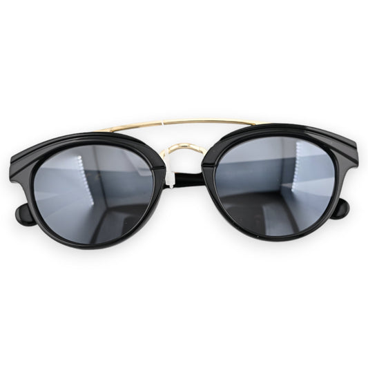 Runde Designbrille mit schwarzem Rahmen und goldenem Quersteg