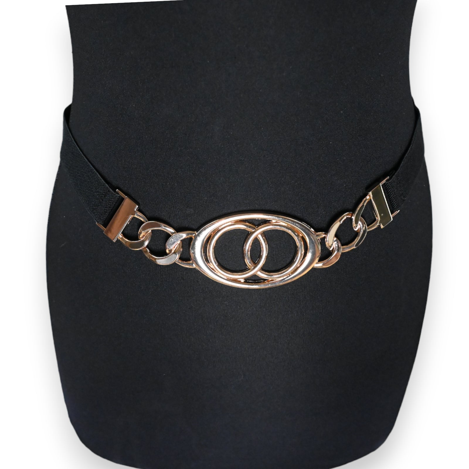 Eleganter elastischer Damen-Gürtel mit goldener Schnalle, zwei ineinander verschlungene Ringe als Verschluss auf schwarzem...