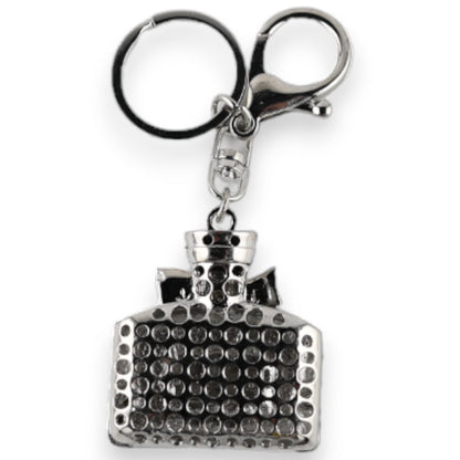 Silberner Schlüsselanhänger in Form einer eleganten Parfümflasche mit glitzernden Kristallen besetzt, Modeschmuck